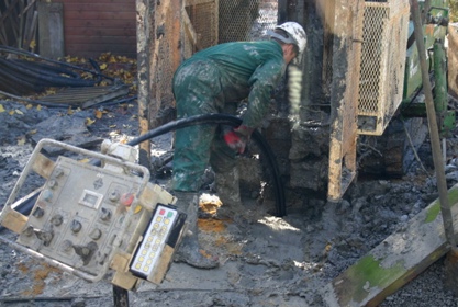 A drill preparing for installation of a ground source heat pump 