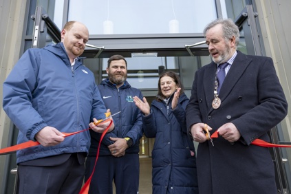 Cllr Bridget Smith, Council Chair Cllr Peter Fane, Mayor of Northstowe Cllr Paul Littlemore and Joe Harper from Elite Sports UK at the opening of the Northstowe Sports Pavilion. The ribbon has just been cut. Image: davidjohnsonphotographic.co.uk
