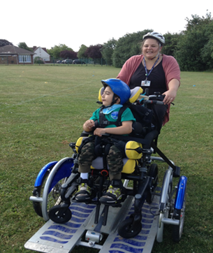 Trying out a specially adapted bike for wheelchair users at Castle School