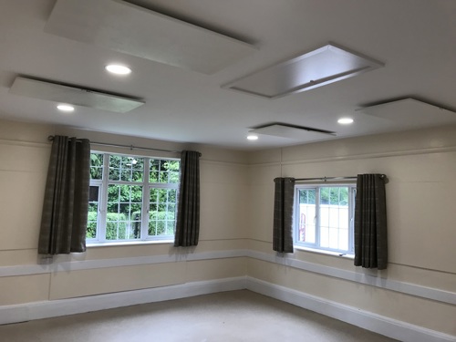 Infrared heating within a village hall meeting room 