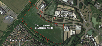 An aerial view of the Cambourne Business Park. There is a red line showing the outline of the proposed housing development area, with Lower Cambourne to the south-east and Cambourne Road to the north-east