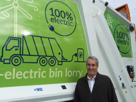 Cllr Brian Milnes with an electric bin lorry