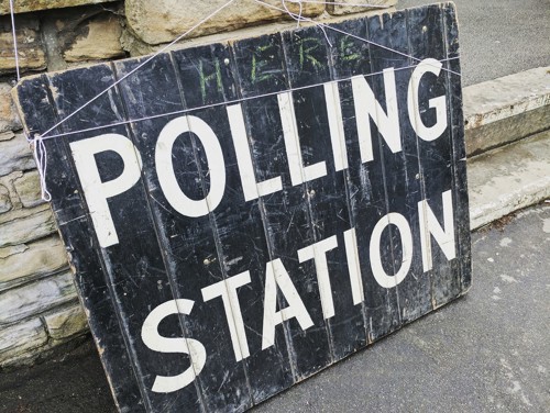 Board saying Polling Station