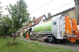 Greater Cambridge Shared Waste's second fully electric bin lorry on a street in Elsworth