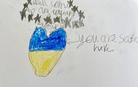 Photo drawn by a six year old for Ukraine, saying 'You are safe here'.
