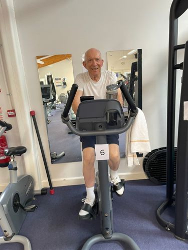 John Goddard on an exercise bike at Gamlingay gym