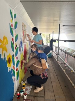 people paint at Meldreth underpass