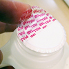 Pull tab / safety seal - like milk bottle or tablet bottle seals