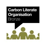 A logo with icons of several people in. There is a speech bubble that says 'Carbon Literate Organisation - Bronze' within that speech bubble.