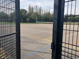 The multi-use games area - or MUGA - at the Northstowe Western Park Pavilion. There are coloured markings painted on the surface to allow for a variety of games to take place.