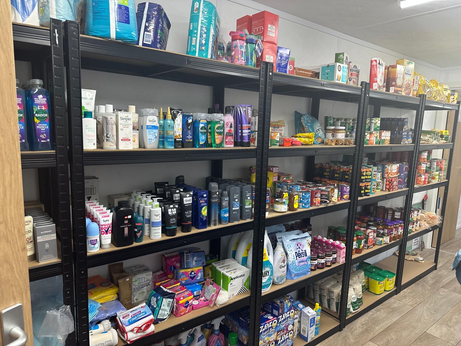Hope CIC community shop shelves of donated items
